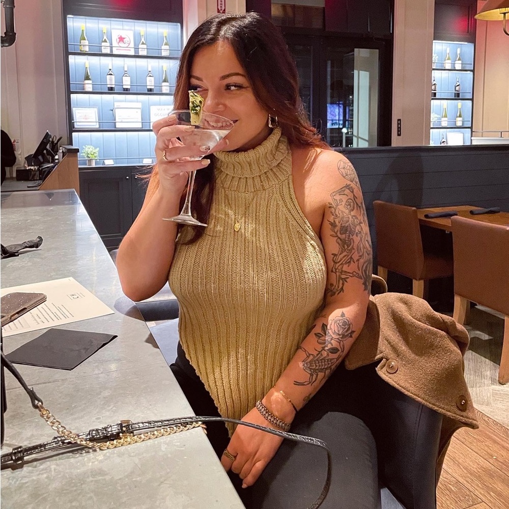 Tan sleeveless/open back turtleneck